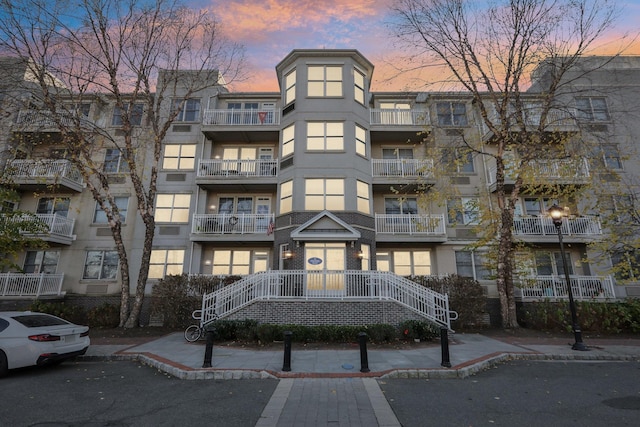 view of outdoor building at dusk