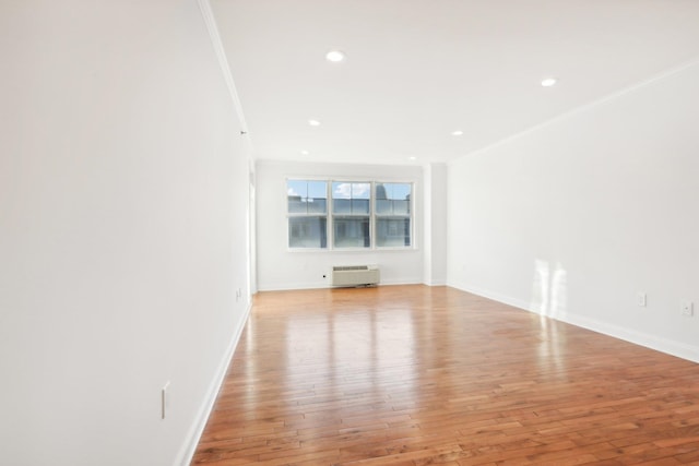 interior space featuring ornamental molding, recessed lighting, baseboards, and hardwood / wood-style floors