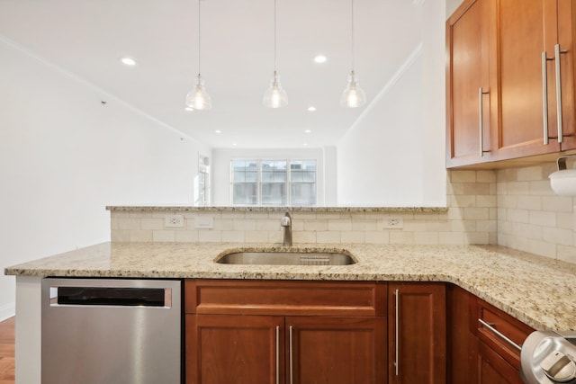 kitchen featuring decorative backsplash, a sink, light stone counters, and stainless steel dishwasher