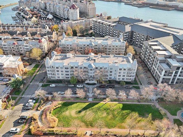 bird's eye view featuring a view of city and a water view