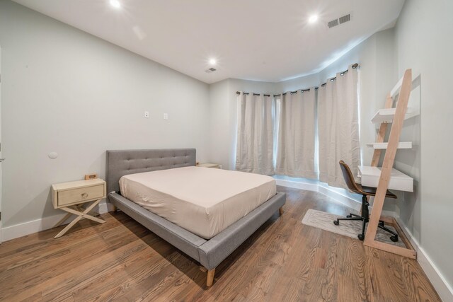 bedroom featuring hardwood / wood-style floors