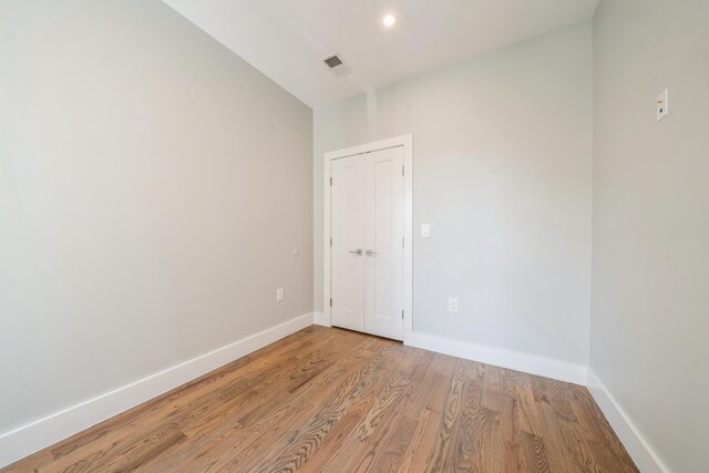 empty room with light hardwood / wood-style flooring