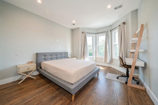 bedroom featuring dark hardwood / wood-style floors