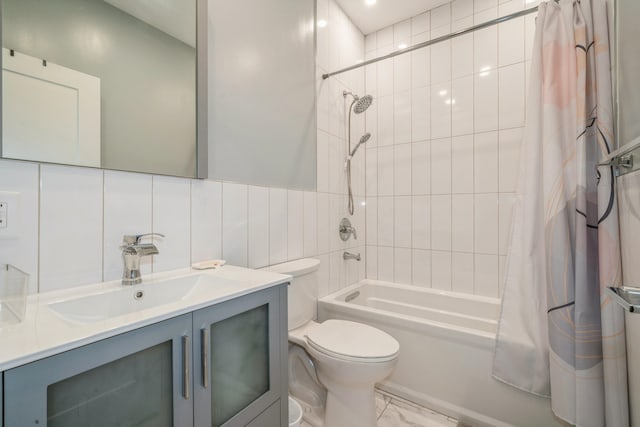 full bathroom featuring shower / tub combo with curtain, tasteful backsplash, vanity, and toilet