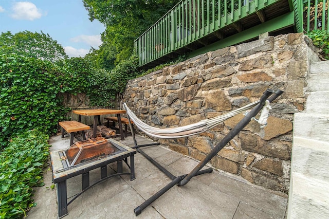 view of patio / terrace featuring a fire pit