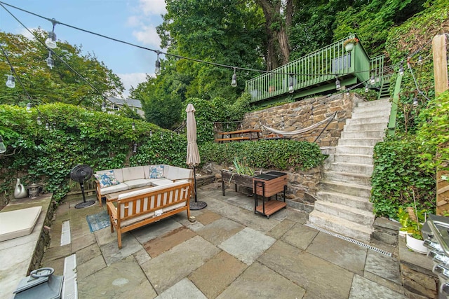 view of patio featuring stairs and an outdoor hangout area