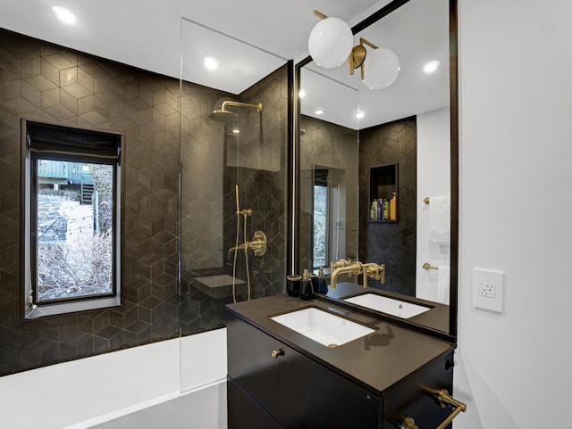 bathroom featuring recessed lighting, a walk in shower, tile walls, and vanity