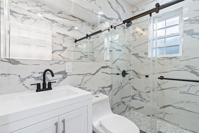 133 W 4th St, Bayonne, NJ 07002 - bathroom with tile walls, a marble finish shower, vanity, and toilet