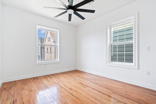133 W 4th St, Bayonne, NJ 07002 - spare room with light wood-style flooring, baseboards, and ceiling fan