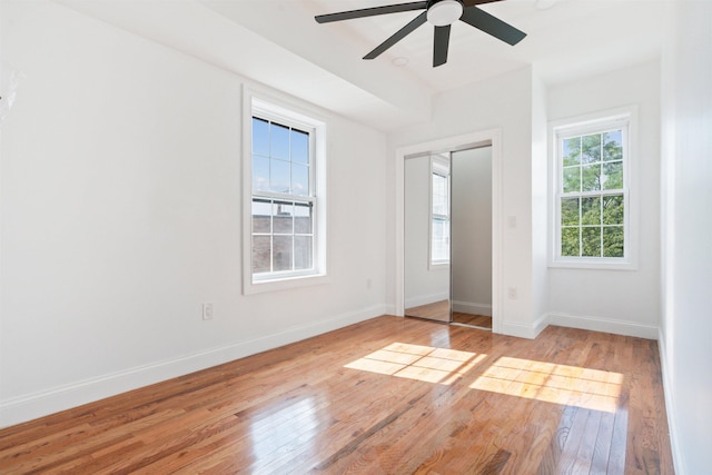 133 W 4th St, Bayonne, NJ 07002 - unfurnished bedroom featuring wood finished floors, baseboards, and ceiling fan