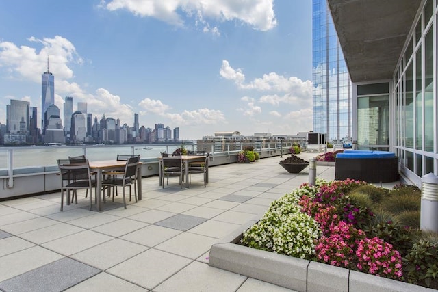 view of patio / terrace with a city view and outdoor dining space