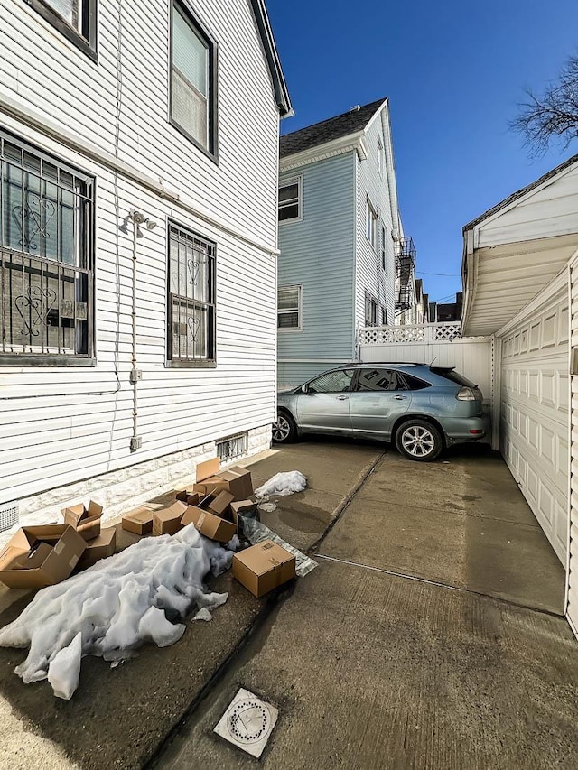 view of home's exterior with fence