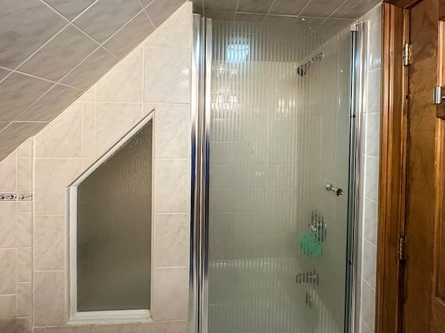 bathroom with a tile shower