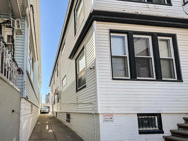 view of side of home featuring crawl space