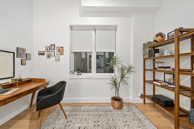 office with light hardwood / wood-style flooring