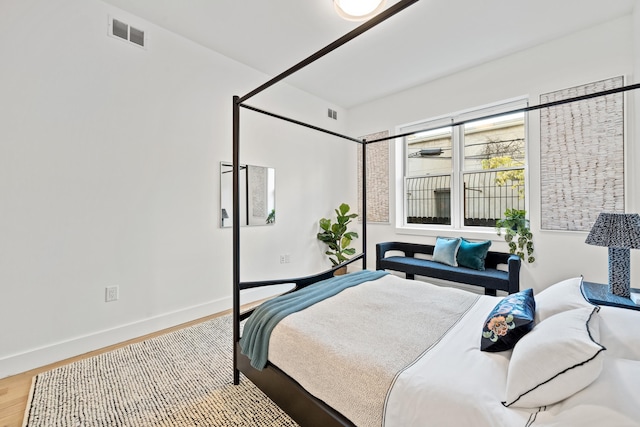 bedroom featuring hardwood / wood-style flooring