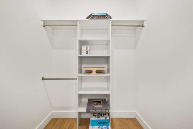 spacious closet featuring hardwood / wood-style floors