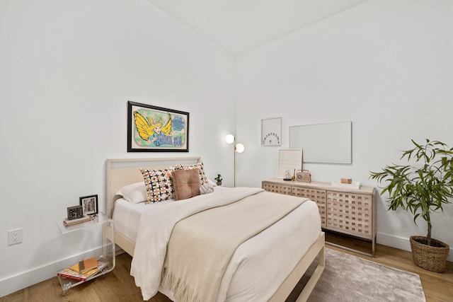 bedroom featuring wood-type flooring