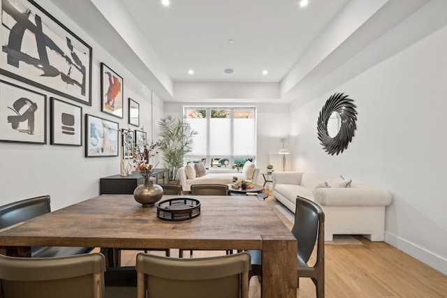 dining space with light hardwood / wood-style flooring