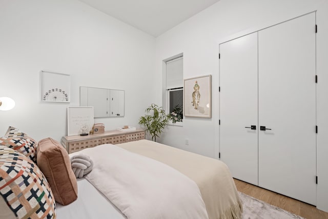 bedroom featuring light hardwood / wood-style floors and a closet