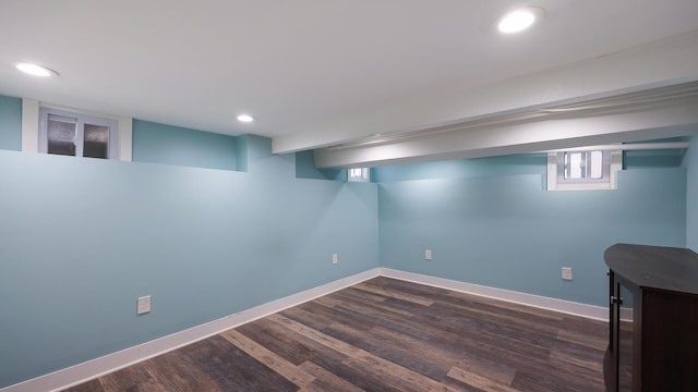 basement featuring dark hardwood / wood-style flooring