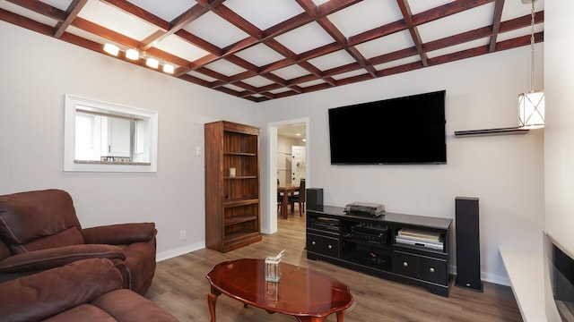 living room featuring coffered ceiling, hardwood / wood-style flooring, and beam ceiling