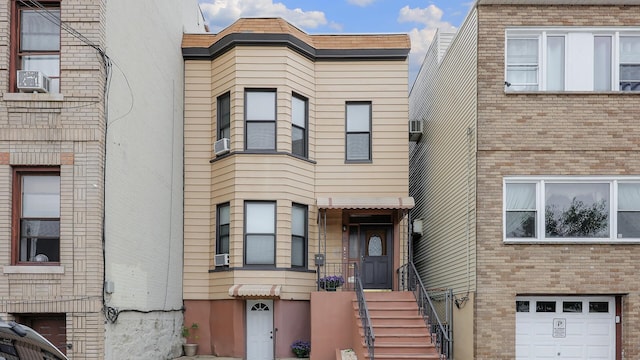 view of front of house featuring cooling unit