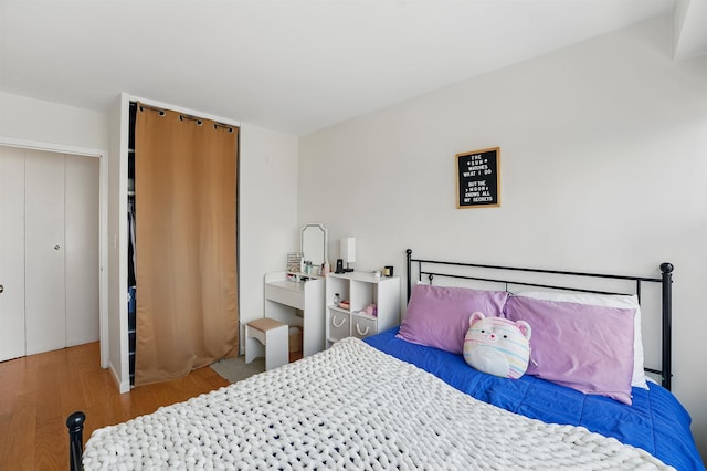 bedroom with wood finished floors