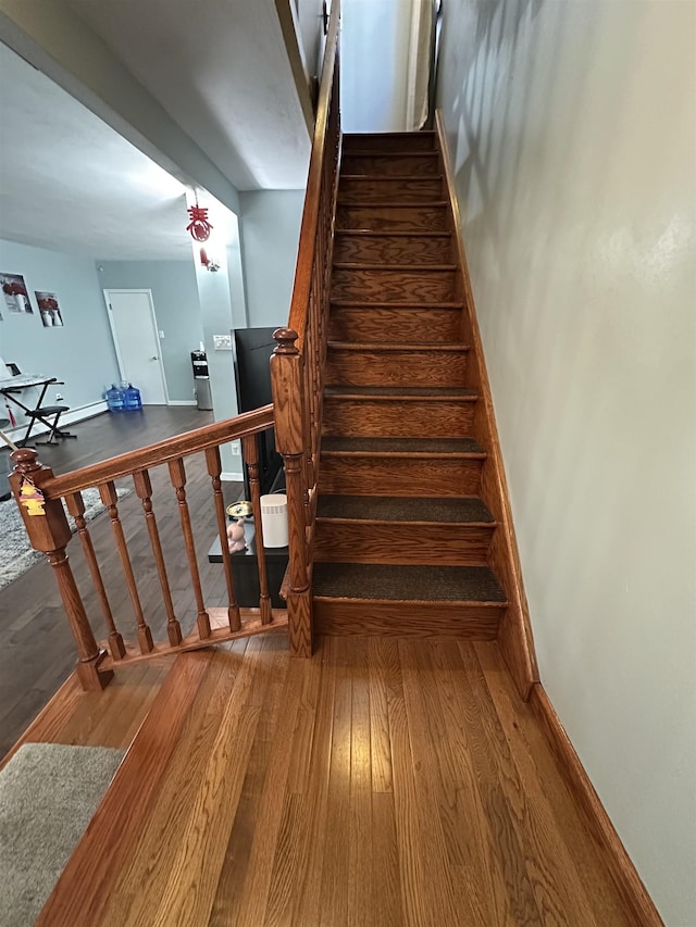 44 W 16th St Unit 1 & 2, Bayonne, NJ 07002 - stairs with wood finished floors and baseboards
