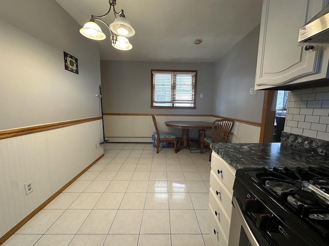 44 W 16th St Unit 1 & 2, Bayonne, NJ 07002 - kitchen featuring range with gas cooktop, a baseboard heating unit, light tile patterned floors, a chandelier, and range hood