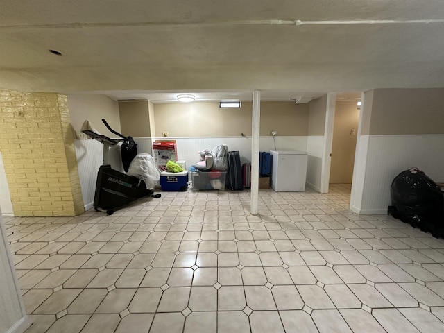44 W 16th St Unit 1 & 2, Bayonne, NJ 07002 - finished below grade area with light floors, refrigerator, and wainscoting