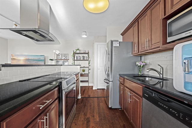 kitchen featuring dark wood-style floors, backsplash, island exhaust hood, stainless steel appliances, and a sink