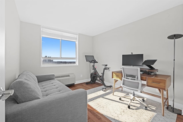 office space featuring baseboards and wood finished floors