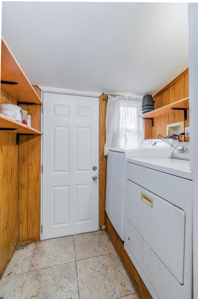 clothes washing area featuring laundry area and independent washer and dryer