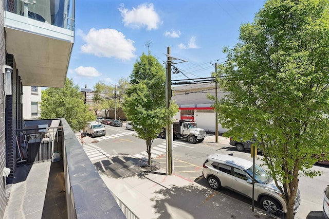 view of street with sidewalks and curbs