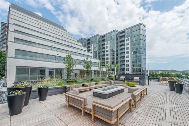 deck featuring an outdoor fire pit