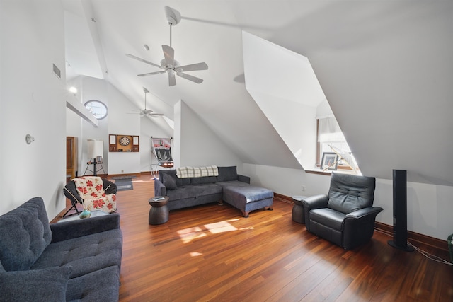 living area featuring visible vents, wood-type flooring, baseboards, ceiling fan, and vaulted ceiling