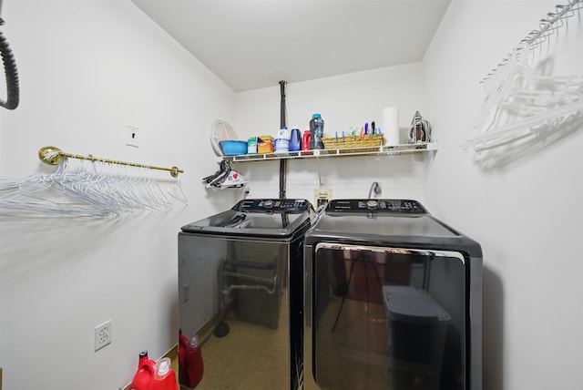 washroom with separate washer and dryer and laundry area