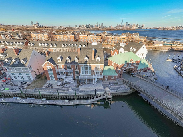 aerial view with a water view and a city view