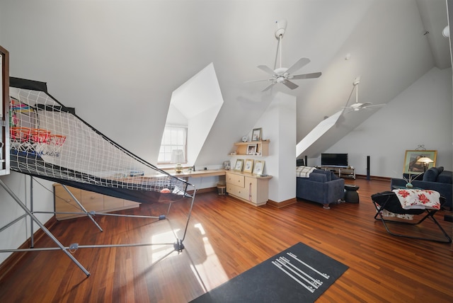 interior space with lofted ceiling, wood finished floors, and a ceiling fan