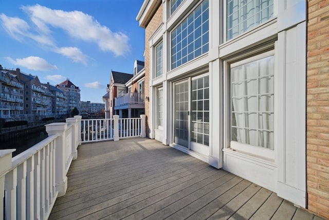 wooden terrace with a city view