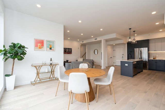 425 3rd St Unit 404, Jersey City, NJ 07302 - dining room with light wood-style flooring, recessed lighting, and stairs