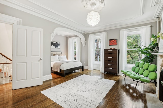 bedroom featuring ornamental molding and dark wood-type flooring