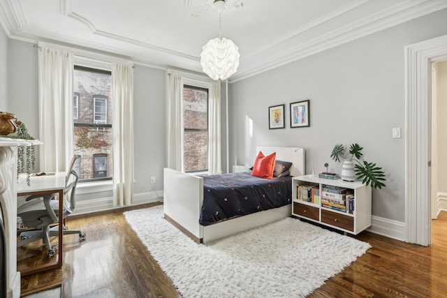 bedroom with a chandelier, dark hardwood / wood-style floors, and crown molding