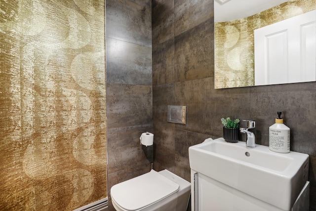 bathroom featuring toilet and vanity