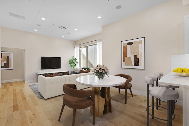 dining space featuring visible vents, recessed lighting, light wood finished floors, and baseboards