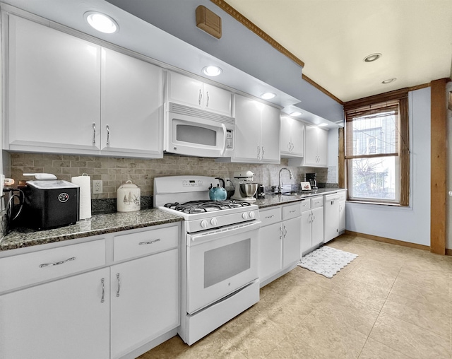 kitchen featuring white cabinetry, white appliances, sink, and decorative backsplash