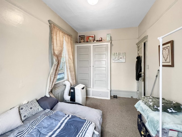 bedroom featuring a closet and carpet