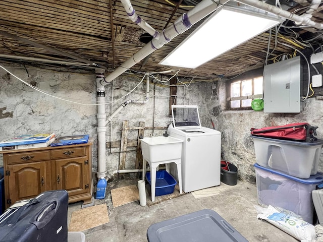 basement featuring washer / clothes dryer and electric panel