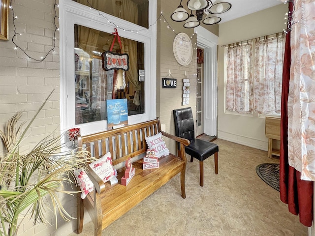 sitting room with brick wall